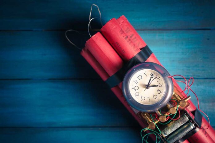 Dynamite with clock timer on blue background.