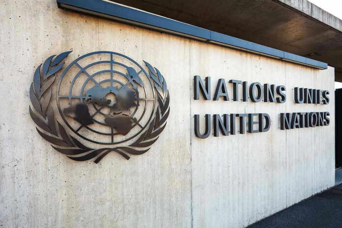 1838738371 United Nations building entrance with logo and name.