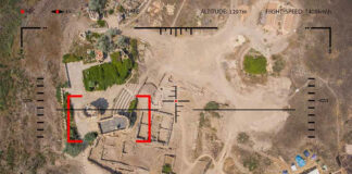 Aerial view through targeting system of ancient ruins.