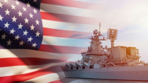 shutterstock2093177332-1jpg US flag and navy warship in the background.