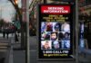 Bus stop display with FBI notice showing multiple suspect photos