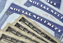 Social Security cards with U.S. dollar bills