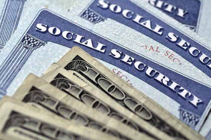 Social Security cards with U.S. dollar bills