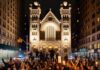 Large crowd of protesters gathered in front of a historic building at night