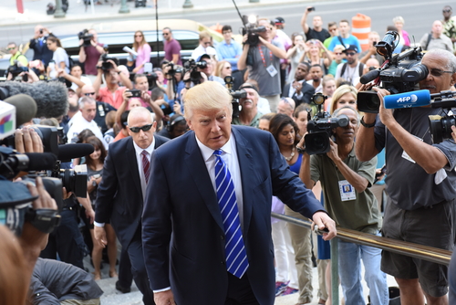 New,York,City,-,August,17,2015:,Republican,Presidential,Nomination A public figure surrounded by a crowd of photographers and onlookers